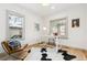 Home office with hardwood floors and a cowhide rug at 2167 S Emerson St, Denver, CO 80210