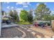 Backyard featuring patio seating, hammock, gravel area and lush lawn at 23634 Broadmoor Dr, Parker, CO 80138