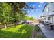 This backyard showcases a well-manicured lawn, outdoor seating, and a paved patio area, ideal for relaxation and entertainment at 23634 Broadmoor Dr, Parker, CO 80138