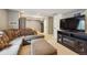 Basement Gathering room with carpet, a TV, neutral colored paint and a plush couch at 23634 Broadmoor Dr, Parker, CO 80138