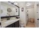 Bathroom featuring granite counters, toilet, and in-room laundry with modern washer and dryer at 23634 Broadmoor Dr, Parker, CO 80138