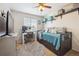 Cozy bedroom featuring a daybed with trundle, desk, and window for natural light at 23634 Broadmoor Dr, Parker, CO 80138