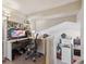 Dedicated home office with a built-in desk, shelves, and ample natural light for a productive workspace at 23634 Broadmoor Dr, Parker, CO 80138