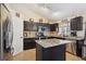 Contemporary kitchen featuring granite island, stainless appliances, and ample cabinet storage at 23634 Broadmoor Dr, Parker, CO 80138
