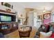 Inviting living room showcasing a cozy seating area, staircase, and open entryway for a welcoming ambiance at 23634 Broadmoor Dr, Parker, CO 80138