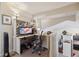 Functional home office space featuring built-in shelving, ample desk space, and comfortable seating at 23634 Broadmoor Dr, Parker, CO 80138