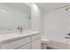 Bathroom featuring shower over tub and white cabinets and vanity at 1284 S Algonquian St, Aurora, CO 80018