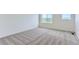 Spacious bedroom featuring neutral carpet and large windows at 1284 S Algonquian St, Aurora, CO 80018