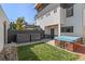 Modern backyard with a hot tub, a green lawn, and a sleek fence, perfect for outdoor enjoyment at 4506 N Vrain St, Denver, CO 80212