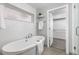 Modern bathroom featuring a freestanding tub, walk in closet, and a decorative window for privacy at 4506 N Vrain St, Denver, CO 80212