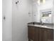 Modern bathroom featuring a sleek vanity and a large mirror, with contemporary fixtures and bright lighting at 4506 N Vrain St, Denver, CO 80212