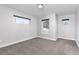 Bright bedroom with neutral carpet and white trim, offering comfortable living space with natural light at 4506 N Vrain St, Denver, CO 80212