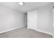 Serene bedroom with plush carpet, and white trim, featuring a closet and access to other rooms at 4506 N Vrain St, Denver, CO 80212