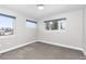 Bright bedroom with neutral carpet, featuring large windows that offer plenty of natural light at 4506 N Vrain St, Denver, CO 80212