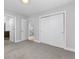 Bedroom with gray carpet, closet, and adjoining bathroom, offering comfort and convenience at 4506 N Vrain St, Denver, CO 80212