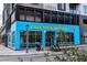 A contemporary building with vibrant blue facade, and 'Call Your Mother' branding and inviting storefront at 4506 N Vrain St, Denver, CO 80212