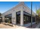 Charming coffee shop exterior with bright white paint, large windows and inviting benches for seating at 4506 N Vrain St, Denver, CO 80212