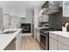 Well-equipped kitchen with modern appliances and an adjacent fireplace at 4506 N Vrain St, Denver, CO 80212