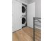 Convenient laundry area with stacked washer and dryer, neatly tucked away behind a door at 4506 N Vrain St, Denver, CO 80212