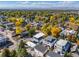 The surrounding area is beautiful with mature trees in autumn colors and mountain views at 4506 N Vrain St, Denver, CO 80212