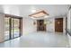 Finished basement with a cozy wood-burning stove and sliding door to backyard at 2518 S Patton Ct, Denver, CO 80219