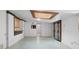 Finished basement with an open layout and pass-through to the kitchen at 2518 S Patton Ct, Denver, CO 80219