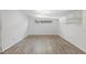 Bedroom featuring neutral walls, updated laminate flooring, and window at 2518 S Patton Ct, Denver, CO 80219