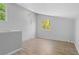 Bonus room featuring wood flooring and light gray walls and trim at 2518 S Patton Ct, Denver, CO 80219