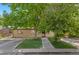 Charming home featuring a well-manicured lawn, beautiful mature trees, and a welcoming front entrance at 2518 S Patton Ct, Denver, CO 80219