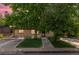 Charming home featuring a well-manicured lawn, beautiful mature trees, and a welcoming front entrance at 2518 S Patton Ct, Denver, CO 80219