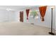 Bright living room with neutral carpet, white walls, and a large window for plenty of natural light at 2518 S Patton Ct, Denver, CO 80219