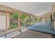 Bright sunroom with sliding glass doors providing views of the backyard garden at 2518 S Patton Ct, Denver, CO 80219
