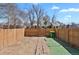 Backyard with fenced-in yard, brick walkway, and minimal grass at 1287 Benton St, Lakewood, CO 80214