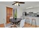 Cozy dining area with a round table, modern chairs, and a view of the kitchen, perfect for gatherings at 1287 Benton St, Lakewood, CO 80214