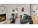 Cozy living room features a fireplace, modern decor, and comfortable seating, creating an inviting atmosphere at 1287 Benton St, Lakewood, CO 80214