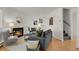 Bright living room featuring a cozy fireplace, modern furniture, and stylish decor for comfortable living at 1287 Benton St, Lakewood, CO 80214