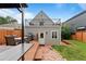 Backyard featuring a deck with dining area and access to the rooftop deck at 2021 Eliot St, Denver, CO 80211