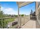 Spacious balcony boasting city views, white railing, and stylish columns at 2021 Eliot St, Denver, CO 80211