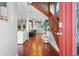 Inviting foyer features wood floors, staircase, and an open view to living spaces at 2021 Eliot St, Denver, CO 80211
