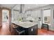 Well-equipped kitchen with stainless steel appliances, granite countertops and a large island with seating at 2021 Eliot St, Denver, CO 80211