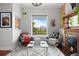 Bright living room featuring city views, fireplace, and comfortable seating at 2021 Eliot St, Denver, CO 80211