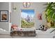 Inviting living room features a large window overlooking the city skyline at 2021 Eliot St, Denver, CO 80211