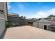 View of the rooftop deck with metal railings and views of surrounding homes at 2021 Eliot St, Denver, CO 80211