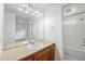 Bathroom featuring vanity, mirror, and a shower/tub with white subway tile at 1915 S Hannibal St # G, Aurora, CO 80013