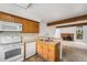 Functional kitchen with white appliances and a breakfast bar at 1915 S Hannibal St # G, Aurora, CO 80013
