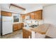 Well-lit kitchen with modern appliances and a view to the outside at 1915 S Hannibal St # G, Aurora, CO 80013