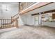 Spacious living area with a staircase, wood beam and adjoins the kitchen at 1915 S Hannibal St # G, Aurora, CO 80013
