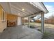 Covered patio with concrete flooring, wood storage, and access to backyard at 2885 Hudson St, Denver, CO 80207