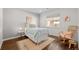 Cozy bedroom with hardwood floors and a charming rocking chair at 2885 Hudson St, Denver, CO 80207