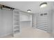 Large walk-in closet with built-in shelving and hanging rods at 2885 Hudson St, Denver, CO 80207